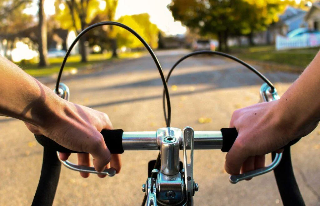 Person riding a bike, representing freedom and forward momentum